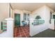 Welcoming patio with tiled floor, seating, and charming decor, perfect for enjoying outdoor living at 4830 Osprey S Dr # 305, St Petersburg, FL 33711