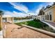 Expansive community pool area with manicured lawn and lake views under a bright blue sky at 4830 Osprey S Dr # 305, St Petersburg, FL 33711
