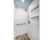 Shower includes white tile, pebbled floor, inset shelves, and a shower bench at 4830 Osprey S Dr # 305, St Petersburg, FL 33711