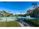 Well-maintained tennis courts with green fencing and lighting, perfect for recreational play at 4830 Osprey S Dr # 305, St Petersburg, FL 33711