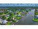 Waterfront home with lush landscaping, boat access, and private pool, creating a serene and luxurious living environment at 5024 Cedarbrook Ln, Hernando Beach, FL 34607