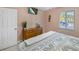 Bright bedroom with a seahorse wall hanging and a TV at 5024 Cedarbrook Ln, Hernando Beach, FL 34607