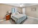 Cozy bedroom featuring a ceiling fan and a serene, tiled floor at 5024 Cedarbrook Ln, Hernando Beach, FL 34607