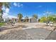 Inviting home features a circular driveway, lush landscaping, and a two-car garage at 5024 Cedarbrook Ln, Hernando Beach, FL 34607