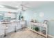 Open concept kitchen and bar area featuring white stools, gray counter tops, and coastal views at 5024 Cedarbrook Ln, Hernando Beach, FL 34607