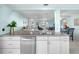 Bright, open kitchen with stainless steel appliances and views into the living area at 5024 Cedarbrook Ln, Hernando Beach, FL 34607