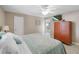 Comfortable bedroom with an ensuite bathroom and ample storage space at 5024 Cedarbrook Ln, Hernando Beach, FL 34607