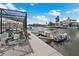 Screened-in pool, dock, and waterfront access provide the perfect outdoor entertainment space at 5024 Cedarbrook Ln, Hernando Beach, FL 34607