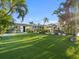 Backyard area with a grill and tropical landscaping at 505 55Th Ave, St Pete Beach, FL 33706