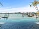 Gorgeous waterfront view from the infinity pool overlooking the serene waters and surrounding landscape at 505 55Th Ave, St Pete Beach, FL 33706