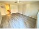 Living room featuring a ceiling fan, wood-look floors and a closet at 5603 Sycamore N St # 5603, St Petersburg, FL 33703