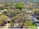 A nice aerial view shows the neighborhood homes with mature trees at 5822 Silver Moon Ave, Tampa, FL 33625