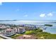 Beautiful aerial view showcasing the waterfront location with a marina and residences against a clear blue sky at 5823 Bowen Daniel Dr # 1606, Tampa, FL 33616