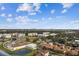 Stunning aerial view of the community showcasing the beautiful landscaping and city skyline in the distance at 5823 Bowen Daniel Dr # 1606, Tampa, FL 33616