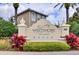 Westshore Yacht Club community sign surrounded by lush landscaping and palm trees on a sunny day at 5823 Bowen Daniel Dr # 1606, Tampa, FL 33616