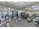 Modern gym with high-end equipment and mirrored walls for a comprehensive fitness experience at 5823 Bowen Daniel Dr # 1606, Tampa, FL 33616