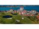 Stunning aerial view of community with golf course, water, and residential buildings at 6210 Sun Blvd # 408, St Petersburg, FL 33715
