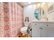 Cozy bathroom featuring a vanity, toilet, and patterned shower curtain at 6210 Sun Blvd # 408, St Petersburg, FL 33715