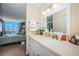 Well-lit bathroom with a modern vanity, white cabinetry, and decorative fixtures at 6210 Sun Blvd # 408, St Petersburg, FL 33715