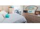 Bright bedroom featuring a workspace, dresser and mirror, and spacious closet at 6210 Sun Blvd # 408, St Petersburg, FL 33715