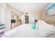 Bright bedroom with beachy accents, closet and dresser with mirror at 6210 Sun Blvd # 408, St Petersburg, FL 33715