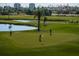 Scenic golf course with lush green fairways, palm trees, and water features for an active outdoor lifestyle at 6210 Sun Blvd # 408, St Petersburg, FL 33715