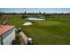 Golf course view featuring manicured greens, water features, and golf carts at 6210 Sun Blvd # 408, St Petersburg, FL 33715