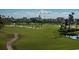 Beautiful golf course view with lush greenery, sand traps, and palm trees at 6210 Sun Blvd # 408, St Petersburg, FL 33715