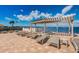Relaxing hot tub under a covered pergola with views of the tranquil blue waters at 6210 Sun Blvd # 408, St Petersburg, FL 33715