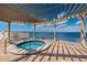 Inviting hot tub under a shaded pergola overlooking the open water at 6210 Sun Blvd # 408, St Petersburg, FL 33715