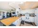 Efficient kitchen featuring white appliances, butcher block countertops, and tiled backsplash at 6210 Sun Blvd # 408, St Petersburg, FL 33715