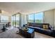 Inviting living room with sliding doors to balcony and expansive outdoor views at 6210 Sun Blvd # 408, St Petersburg, FL 33715