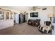 Cozy living room featuring comfortable seating, a display cabinet, and ample natural light at 6210 Sun Blvd # 408, St Petersburg, FL 33715