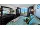 Comfortable main bedroom with view of the golf course and tasteful décor at 6210 Sun Blvd # 408, St Petersburg, FL 33715