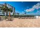 Serene patio with lounge chairs and outdoor dining area, perfect for relaxation and entertaining at 6210 Sun Blvd # 408, St Petersburg, FL 33715