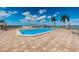 Inviting pool surrounded by lounge chairs, perfect for soaking up the sun in a tranquil setting at 6210 Sun Blvd # 408, St Petersburg, FL 33715