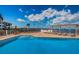 Gorgeous pool with a sunshade area and lounge chairs provides a perfect spot for relaxation at 6210 Sun Blvd # 408, St Petersburg, FL 33715