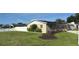 Spacious backyard with green grass and a white vinyl fence for privacy at 6310 57Th N Ave, St Petersburg, FL 33709