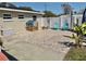 Charming backyard featuring brick pavers, a playhouse, and outdoor seating, creating a delightful space at 6310 57Th N Ave, St Petersburg, FL 33709
