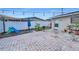 Backyard space with a play area, a grill, plants, and string lights overhead at 6310 57Th N Ave, St Petersburg, FL 33709