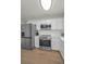 Close up of modern kitchen, stainless steel appliances, light countertops, and ample cabinet space at 6310 57Th N Ave, St Petersburg, FL 33709