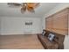Inviting living room featuring modern wood flooring and neutral decor, illuminated by natural light from the window at 6310 57Th N Ave, St Petersburg, FL 33709