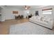 Spacious open floor plan with a cozy living area, a dining set, and wood flooring throughout, offering a warm, inviting space at 6310 57Th N Ave, St Petersburg, FL 33709