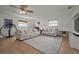 Bright living room with hardwood floors, modern sofas, and decorative bicycle art at 6310 57Th N Ave, St Petersburg, FL 33709