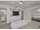 Spacious main bedroom with ceiling fan, carpet, large closet with mirrored sliding doors, and en suite bath at 6310 57Th N Ave, St Petersburg, FL 33709