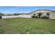 Expansive backyard with lush grass and privacy fence at 6310 57Th N Ave, St Petersburg, FL 33709