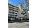 Multi-story condo building with a well-maintained exterior and convenient parking at 6425 Shoreline Dr # 10506, St Petersburg, FL 33708