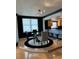 Stylish dining area with modern lighting, adjacent to the kitchen bar at 6425 Shoreline Dr # 10506, St Petersburg, FL 33708