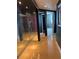 Hallway with mirrored closet doors, natural light, and hardwood flooring at 6425 Shoreline Dr # 10506, St Petersburg, FL 33708