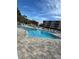 Beautiful community pool with clear blue water, lounge chairs, and surrounding landscaping at 6425 Shoreline Dr # 10506, St Petersburg, FL 33708